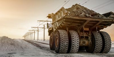 Large mining machine in the sunset